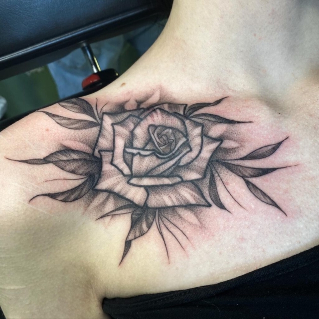 Black and grey rose tattoo by Zac